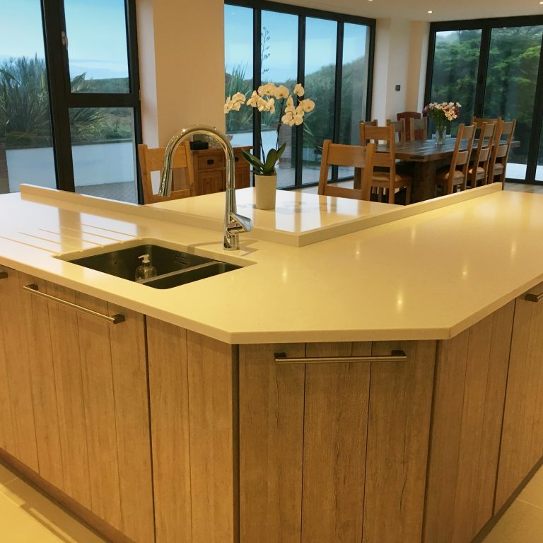 Kitchen island with sink and seating area