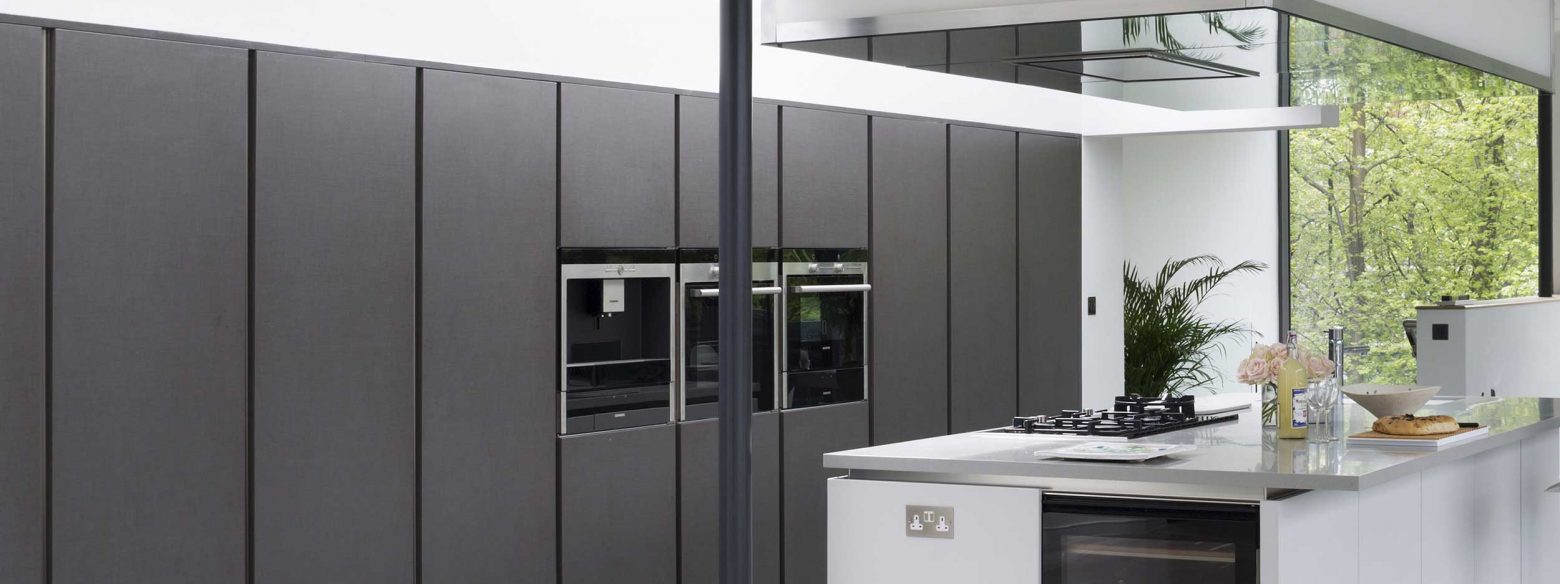 Black seamless kitchen design with white units